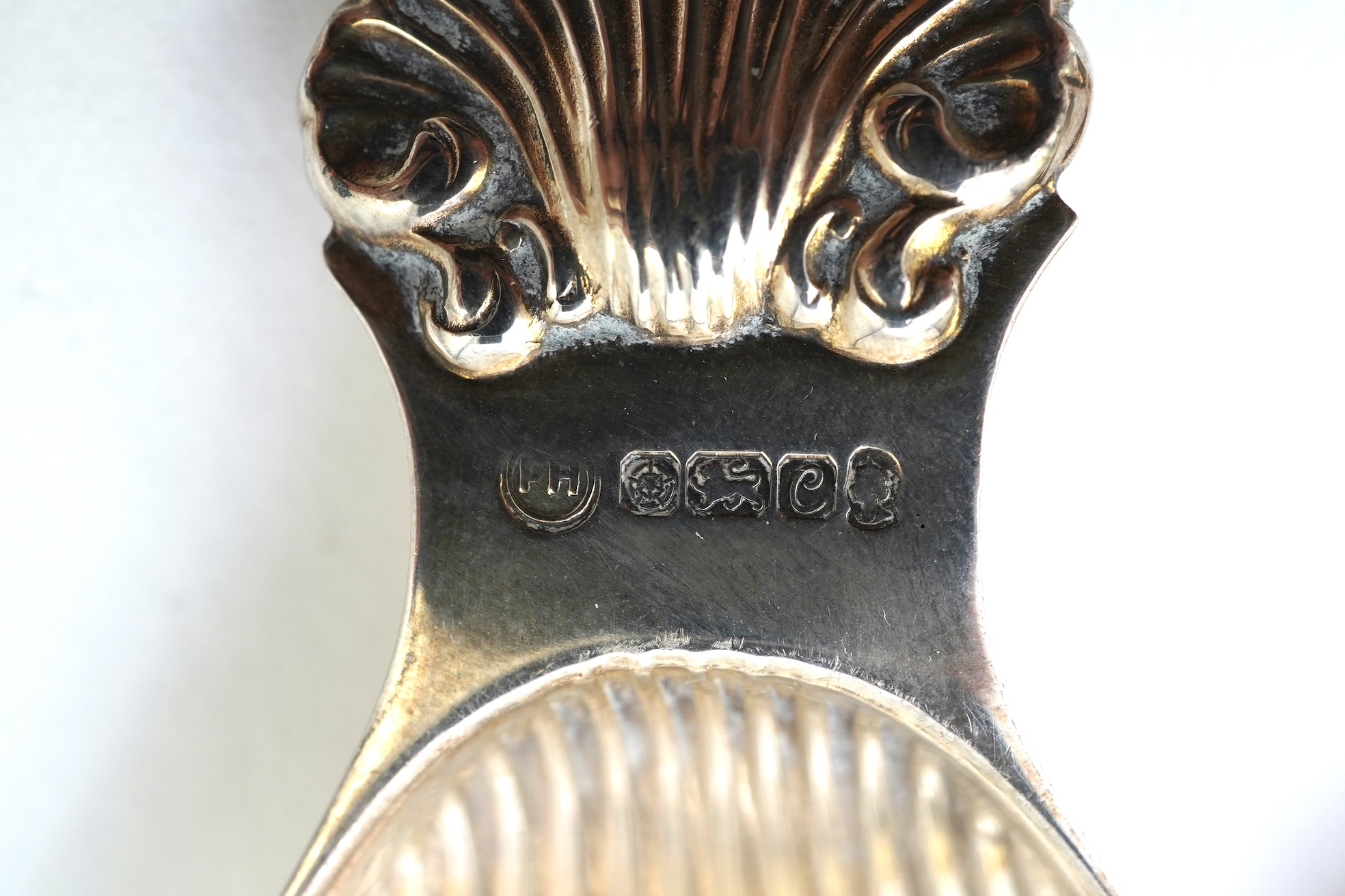 Ten assorted 19th and 20th century silver caddy spoons, with shell or fluted bowls